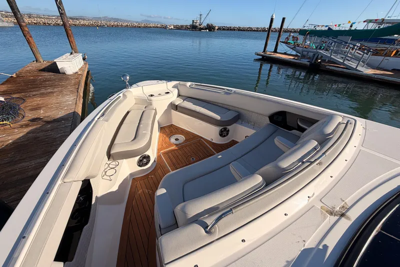  Yacht Photos Pics 2021 Sea Ray SLX 400 boat docked, featuring spacious seating and elegant design.