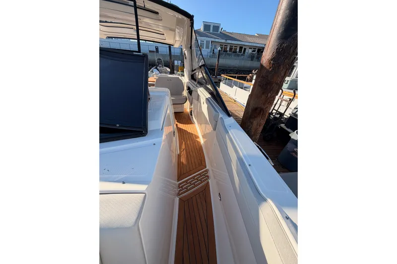  Yacht Photos Pics 2021 Sea Ray SLX 400 boat with teak deck, docked at marina.