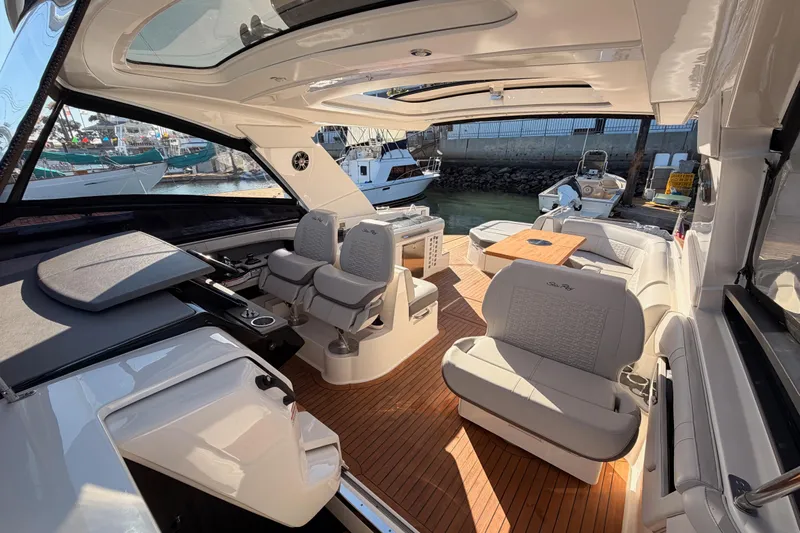  Yacht Photos Pics Luxurious 2021 Sea Ray SLX 400 boat interior with elegant seating and wooden flooring.