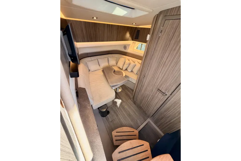  Yacht Photos Pics Luxurious interior of 2021 Sea Ray SLX 400 yacht with cozy seating and modern design.
