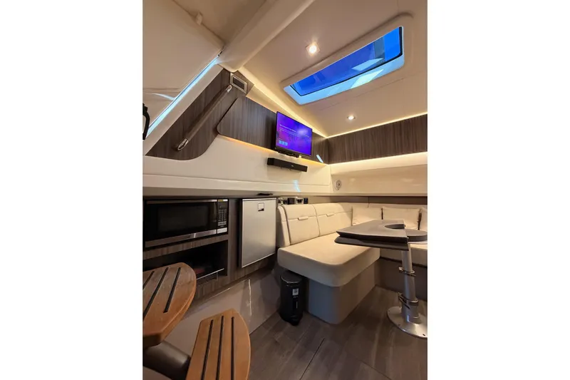 Yacht Photos Pics Luxurious interior of 2021 Sea Ray SLX 400 yacht with modern amenities and elegant design.