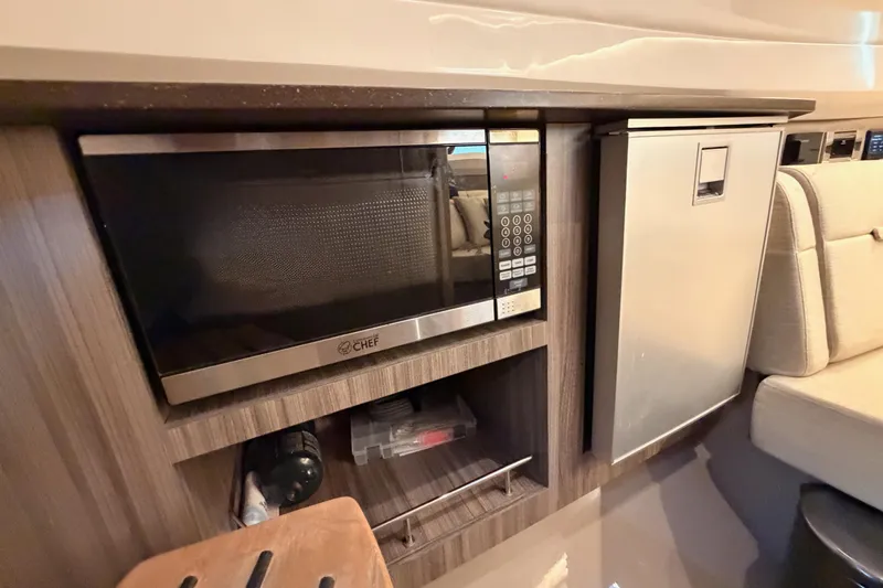  Yacht Photos Pics Interior of 2021 Sea Ray SLX 400 featuring a microwave and compact refrigerator.