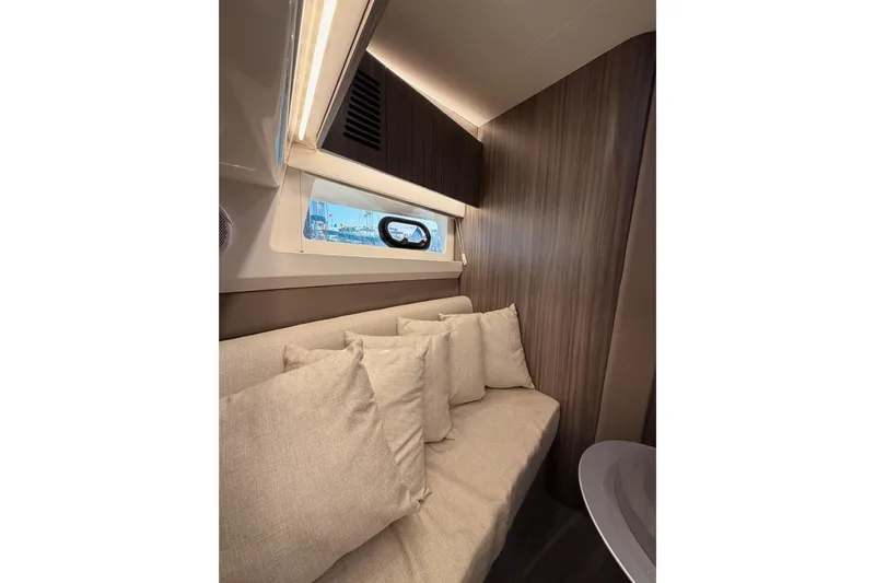  Yacht Photos Pics Interior of 2021 Sea Ray SLX 400 with cozy seating and window view.