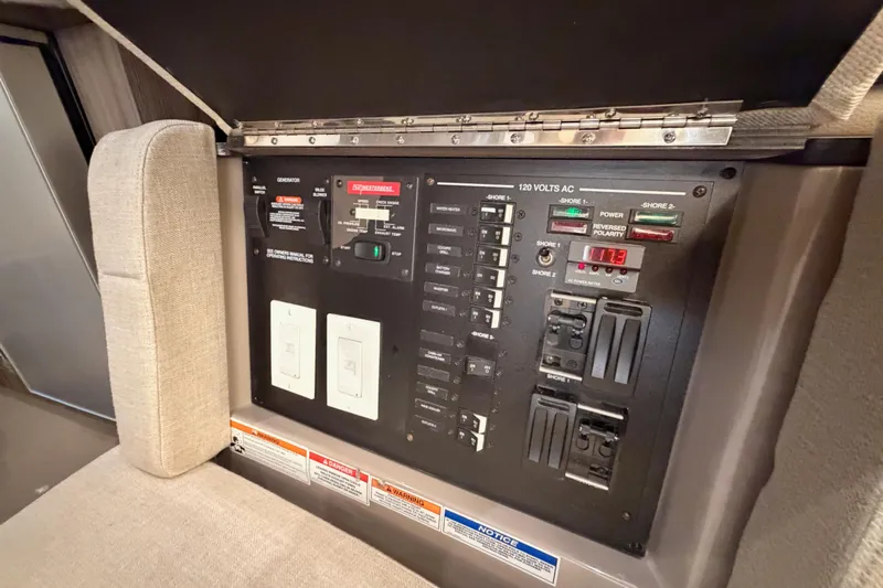  Yacht Photos Pics Electrical control panel on 2021 Sea Ray SLX 400 boat, featuring switches and indicators.