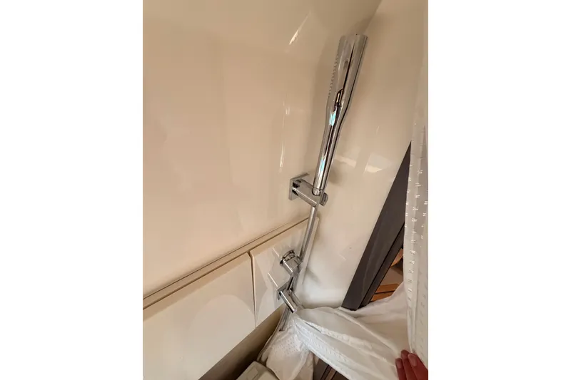  Yacht Photos Pics Shower area in 2021 Sea Ray SLX 400 boat with chrome fixtures.
