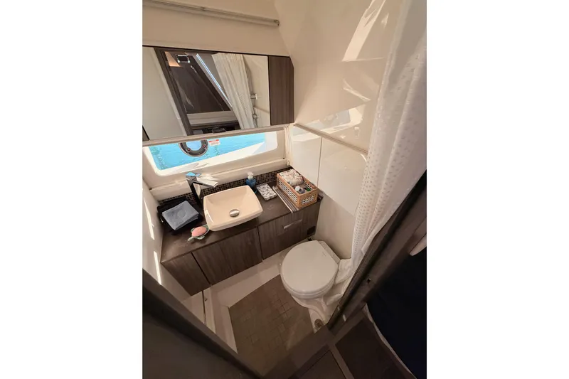 Yacht Photos Pics Luxurious bathroom in 2021 Sea Ray SLX 400 yacht with modern fixtures and elegant design.