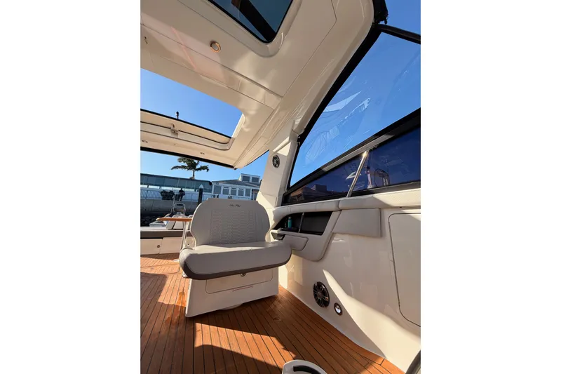  Yacht Photos Pics 2021 Sea Ray SLX 400 interior with seating and wooden flooring.