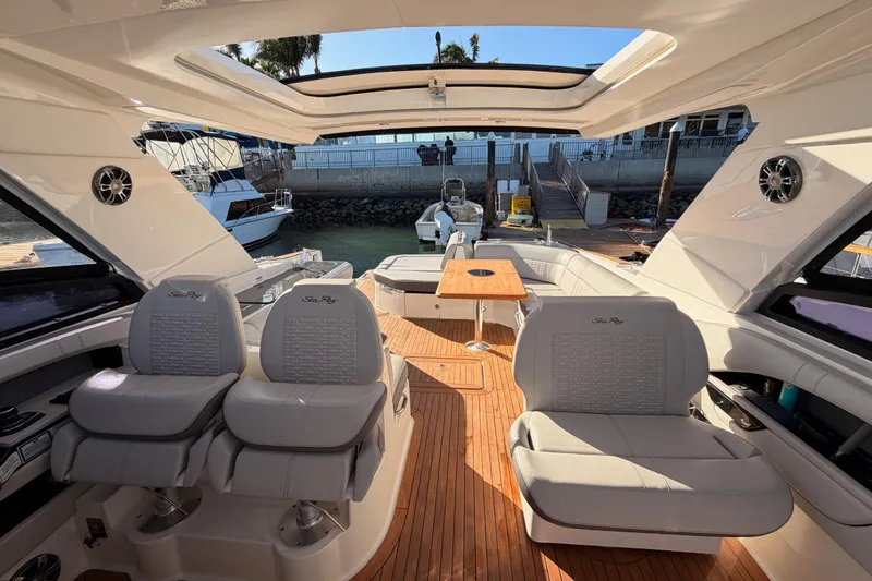  Yacht Photos Pics 2021 Sea Ray SLX 400 boat interior with luxurious seating and wooden deck.
