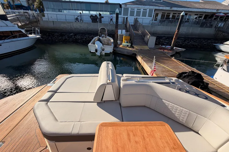  Yacht Photos Pics 2021 Sea Ray SLX 400 luxury boat with spacious seating at marina dock.