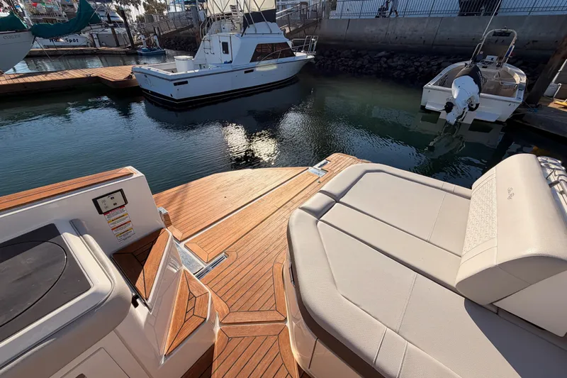  Yacht Photos Pics 2021 Sea Ray SLX 400 boat with teak deck and luxurious seating at marina.