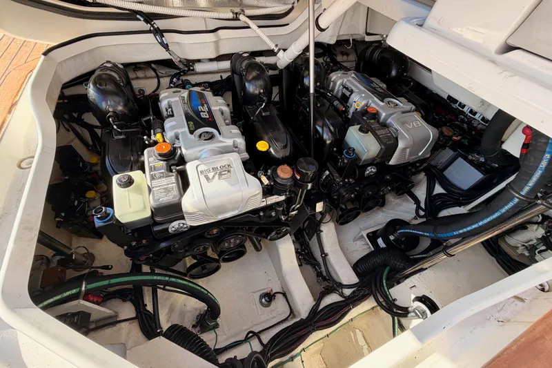  Yacht Photos Pics Engine compartment of 2021 Sea Ray SLX 400 with dual V8 engines, showcasing mechanical components.