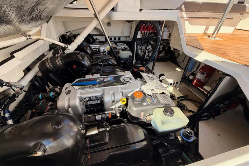  Yacht Photos Pics Engine compartment of a 2021 Sea Ray SLX 400 boat, showcasing detailed mechanical components.