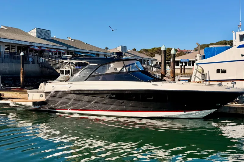  Yacht Photos Pics 2021 Sea Ray SLX 400 boat docked at marina, clear sky, calm water.