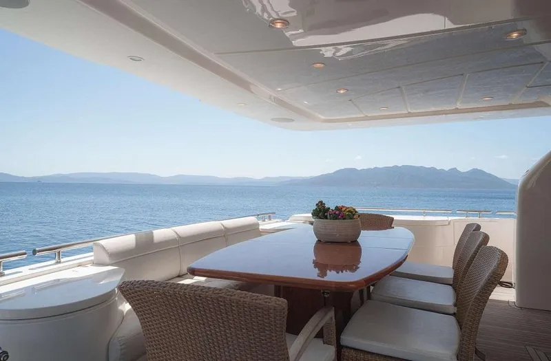 Lidia Yacht Photos Pics Luxurious 2006 Ferretti Yachts 830 deck with ocean view and elegant dining setup.
