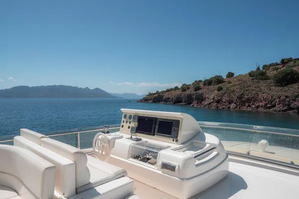 Lidia Yacht Photos Pics Flybridge of 2006 Ferretti Yachts 830 with ocean view and island backdrop.