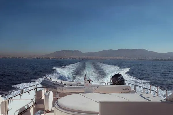 Lidia Yacht Photos Pics 2006 Ferretti Yachts 830 cruising on open sea with scenic mountain backdrop.