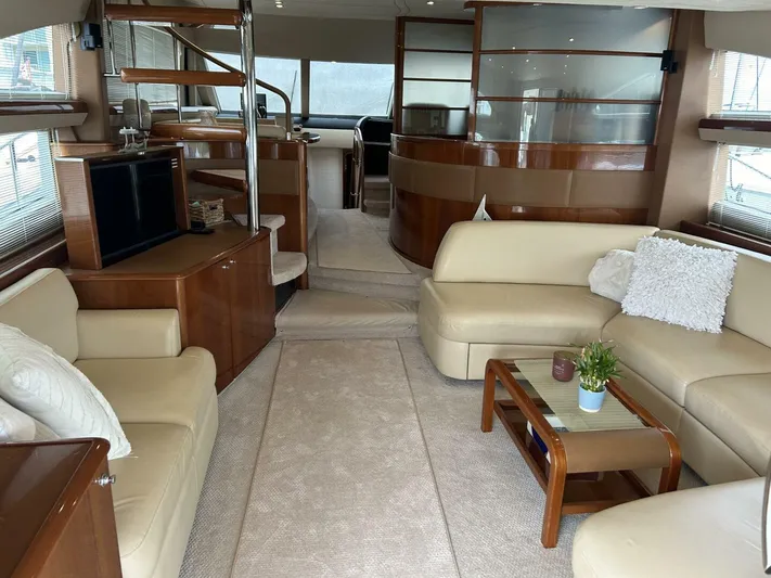 Uniq III Yacht Photos Pics Luxurious interior of a 2008 Princess 67 Flybridge yacht with elegant seating and modern decor.
