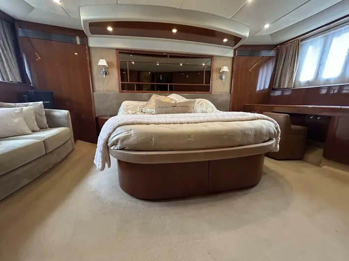 Uniq III Yacht Photos Pics Luxurious bedroom interior of 2008 Princess 67 Flybridge yacht with elegant furnishings.
