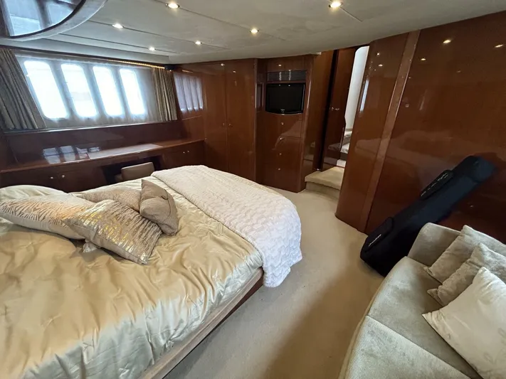Uniq III Yacht Photos Pics Luxurious bedroom interior of 2008 Princess 67 Flybridge yacht with elegant furnishings.