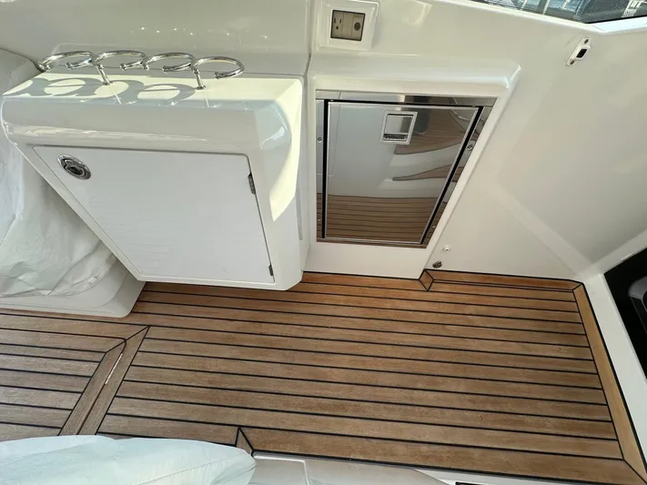 Heidibal 11 Yacht Photos Pics Beneteau Gran Turismo 40 2021 model interior with wooden flooring and storage compartments.