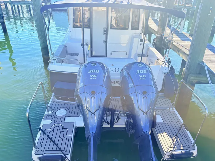 Reliance Yacht Photos Pics 2023 Cutwater 32 Coupe with twin 300 HP V6 engines at the dock.