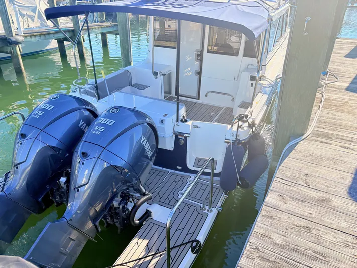 Reliance Yacht Photos Pics 2023 Cutwater 32 Coupe with Yamaha engines at dock.