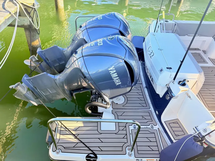 Reliance Yacht Photos Pics 2023 Cutwater 32 Coupe with Yamaha outboard engines at dock.