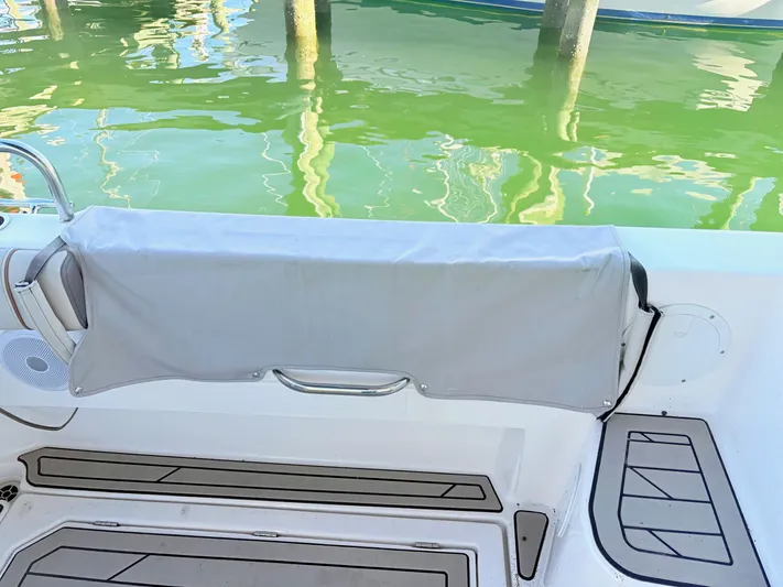 Reliance Yacht Photos Pics 2023 Cutwater 32 Coupe boat with gray cover at dock.