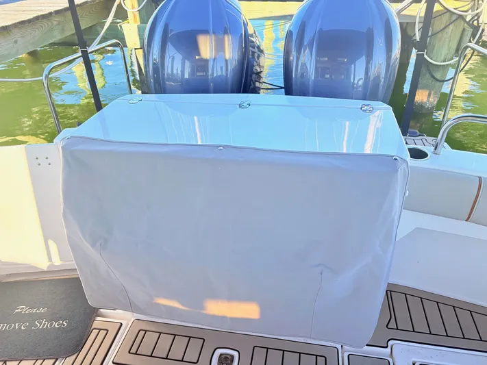 Reliance Yacht Photos Pics 2023 Cutwater 32 Coupe boat with covered engine area.