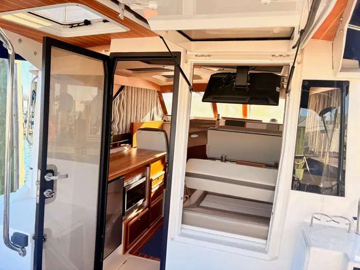 Reliance Yacht Photos Pics Interior view of 2023 Cutwater 32 Coupe with modern amenities.