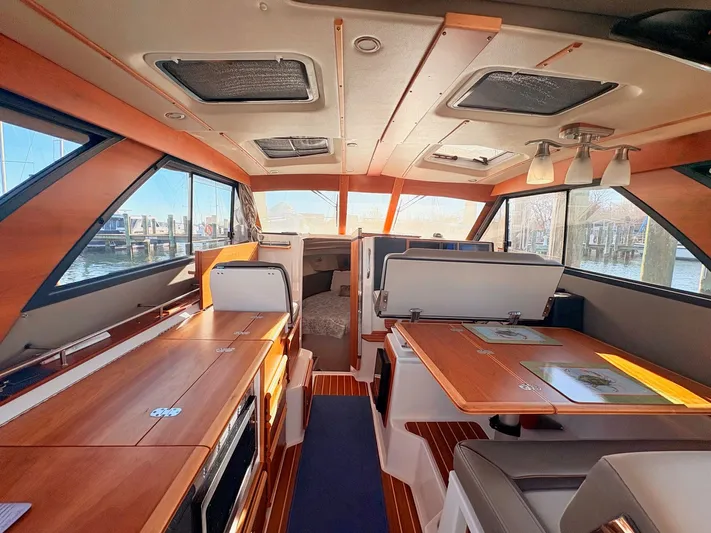 Reliance Yacht Photos Pics Interior of 2023 Cutwater 32 Coupe with wood finish.