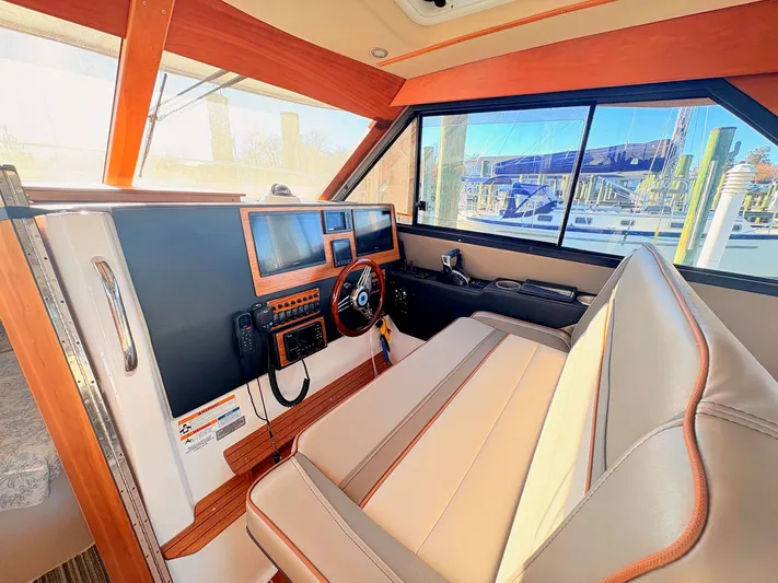 Reliance Yacht Photos Pics Interior of 2023 Cutwater 32 Coupe with modern helm console.