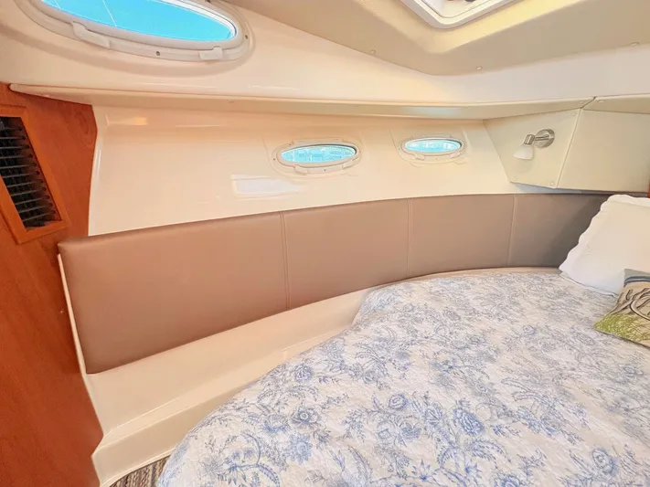 Reliance Yacht Photos Pics Interior of 2023 Cutwater 32 Coupe with bed and portholes.