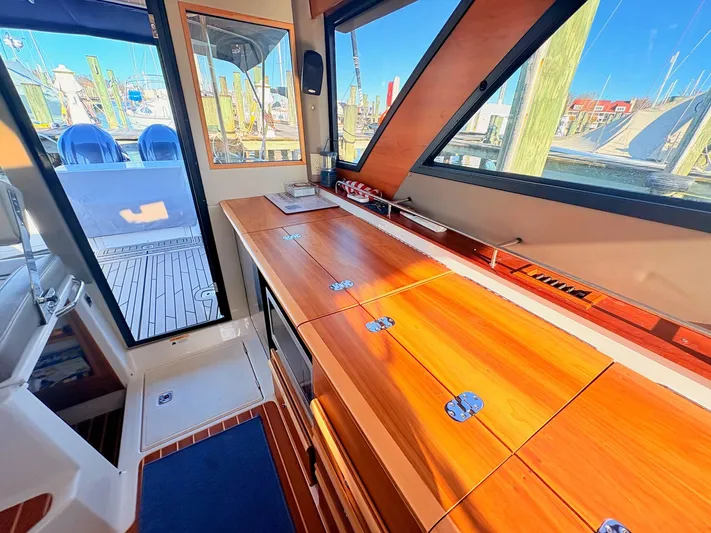 Reliance Yacht Photos Pics Interior of 2023 Cutwater 32 Coupe with wooden finish.