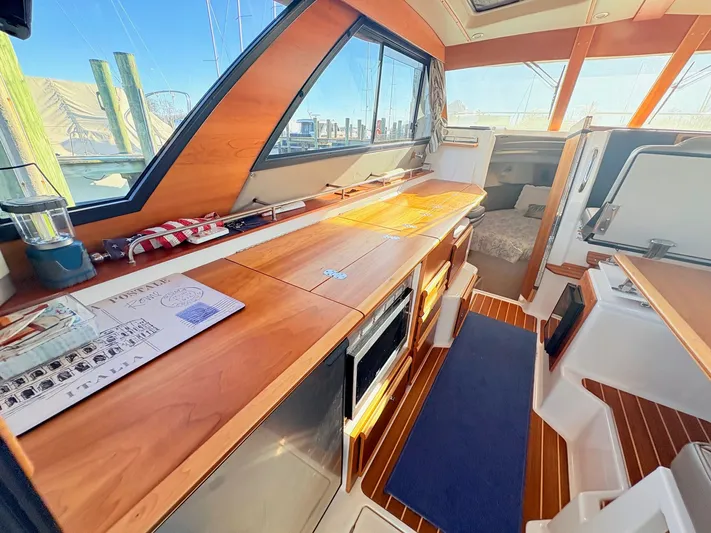 Reliance Yacht Photos Pics Interior of 2023 Cutwater 32 Coupe with wooden finish.