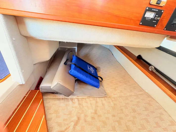 Reliance Yacht Photos Pics Interior of 2023 Cutwater 32 Coupe with cushions and storage area.