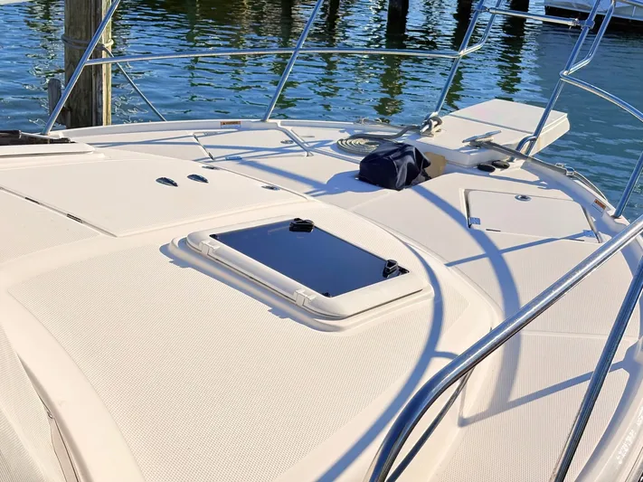 Reliance Yacht Photos Pics Deck of 2023 Cutwater 32 Coupe with water in the background.