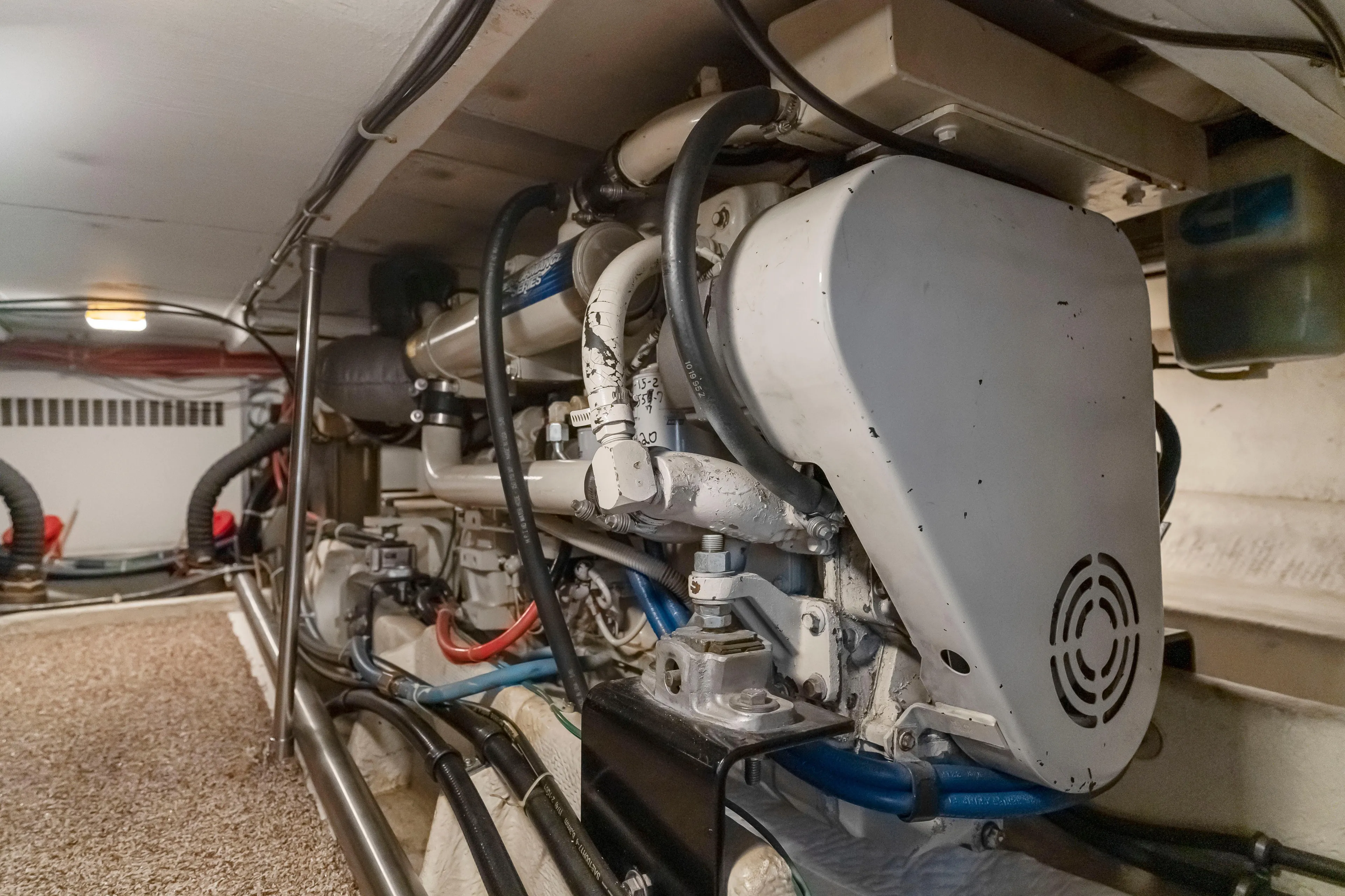 Never Say Never Yacht Photos Pics Engine room of 1997 Bayliner 4788 Pilot House Motoryacht, showcasing mechanical components.