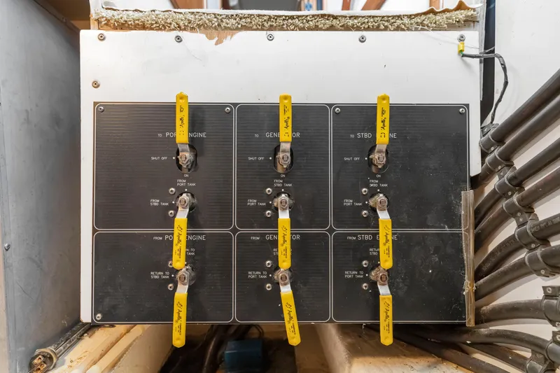 Never Say Never Yacht Photos Pics Control panel with yellow levers on a 1997 Bayliner 4788 Pilot House Motoryacht.