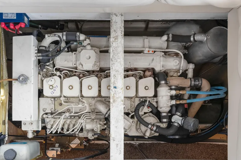 Never Say Never Yacht Photos Pics Engine compartment of a 1997 Bayliner 4788 Pilot House Motoryacht, showcasing detailed components.