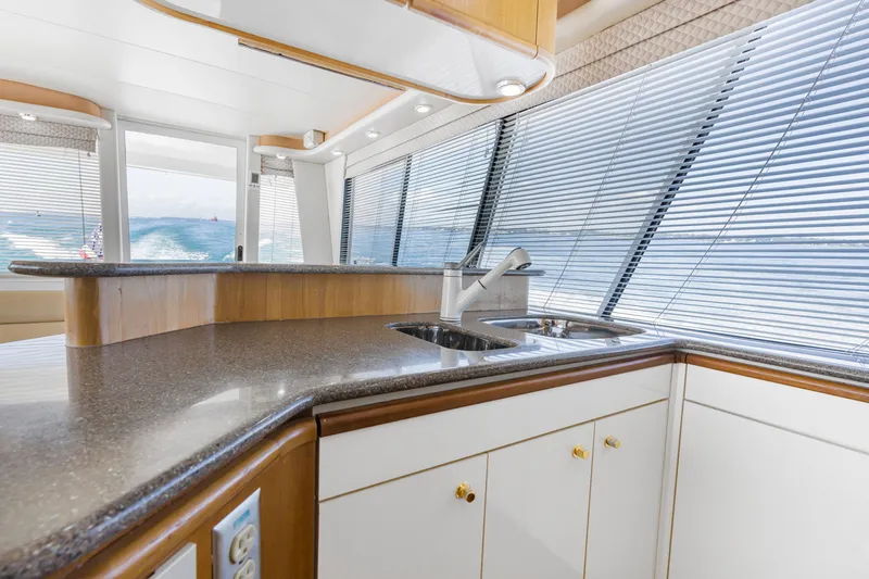 Never Say Never Yacht Photos Pics Luxurious kitchen interior of 1997 Bayliner 4788 Pilot House Motoryacht with ocean view.