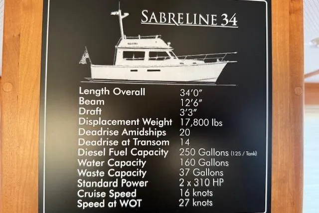 Ocean Baron Yacht Photos Pics 2001 Sabreline Sedan specifications: 34' length, 12'6" beam, 250-gallon diesel capacity, 310 HP power.