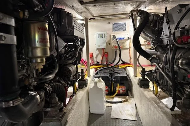 Ocean Baron Yacht Photos Pics Engine room of a 2001 Sabreline Sedan boat, featuring mechanical components and wiring.