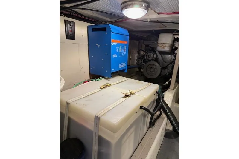 Ocean Baron Yacht Photos Pics Engine room of a 2001 Sabreline Sedan with equipment and storage tank.