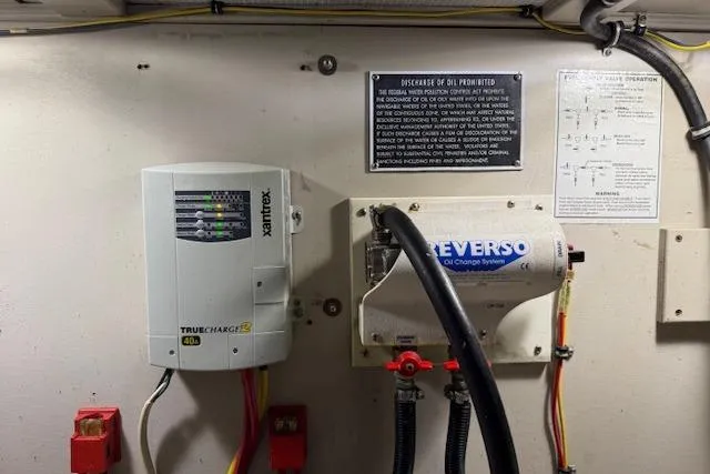 Ocean Baron Yacht Photos Pics Engine room of a 2001 Sabreline Sedan with Xantrex charger and Reverso oil change system.