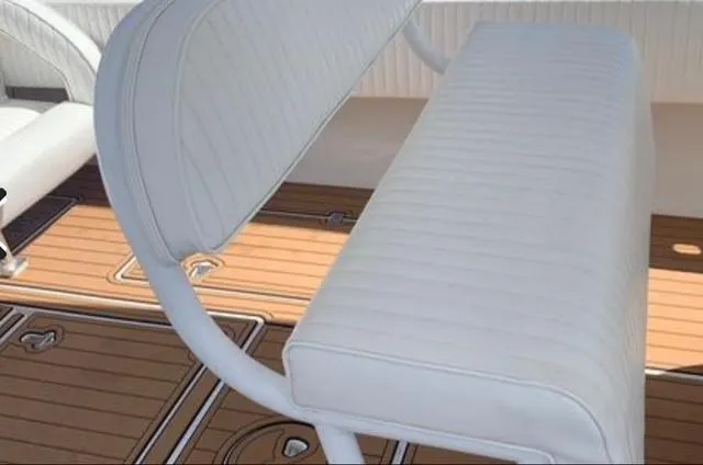  Yacht Photos Pics White cushioned seating on 2008 Intrepid 370 Cuddy boat with wooden deck.