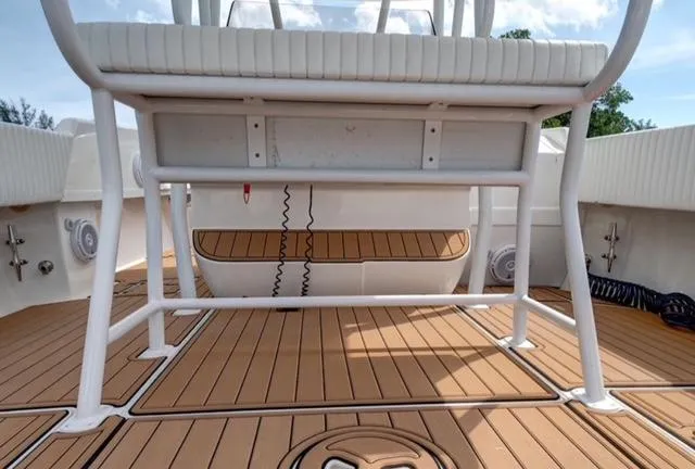  Yacht Photos Pics 2008 Intrepid 370 Cuddy boat deck with white seating and teak flooring.