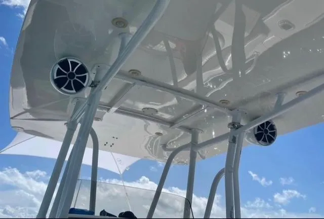  Yacht Photos Pics 2008 Intrepid 370 Cuddy boat roof with speakers against a blue sky.