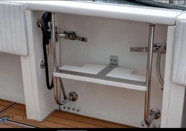  Yacht Photos Pics 2008 Intrepid 370 Cuddy boat interior with stainless steel fittings and teak flooring.