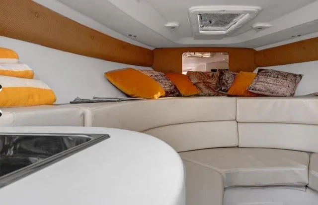  Yacht Photos Pics 2008 Intrepid 370 Cuddy interior with cozy seating and colorful cushions.